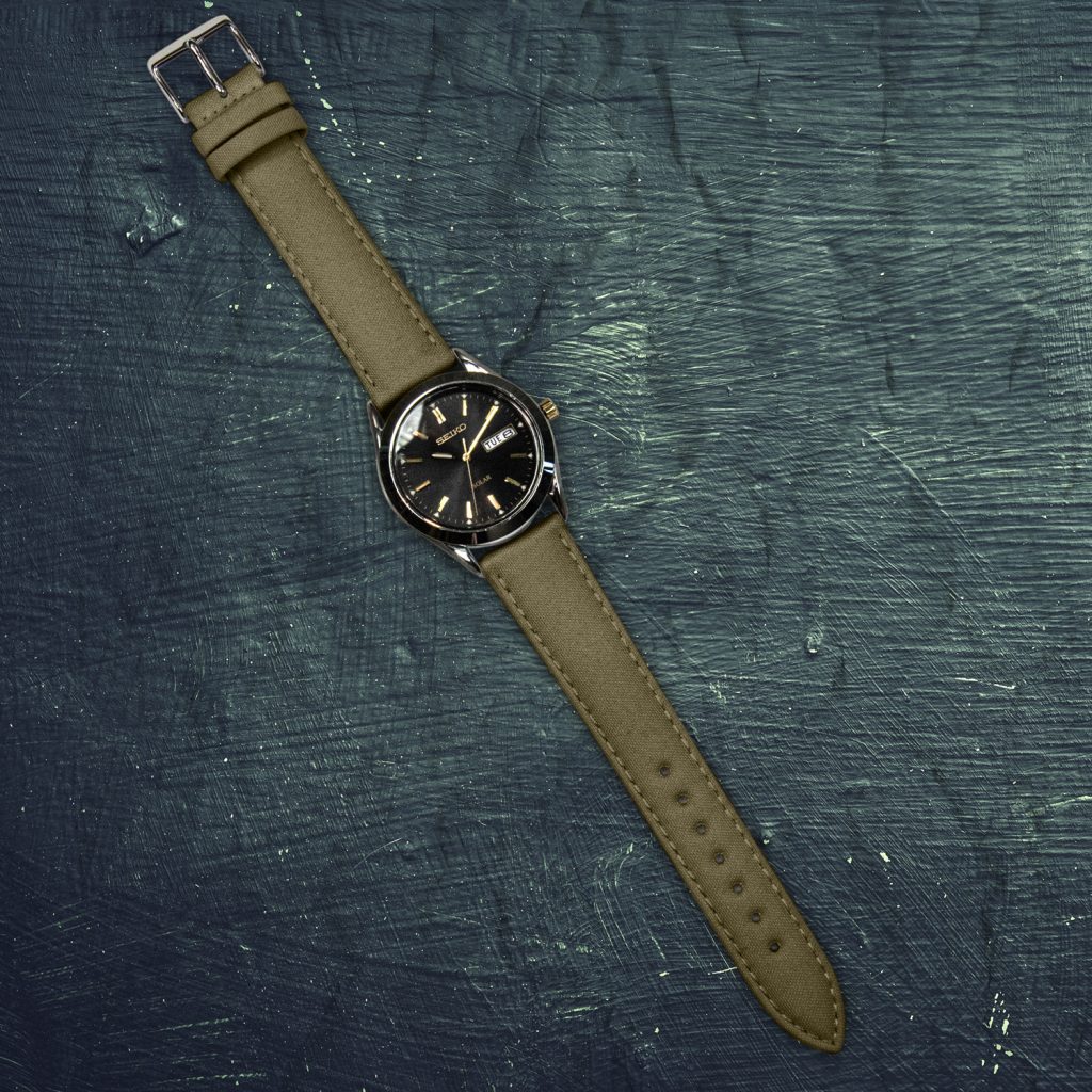 marine green SEAQUAL® watch band with stainless steel buckle on watch